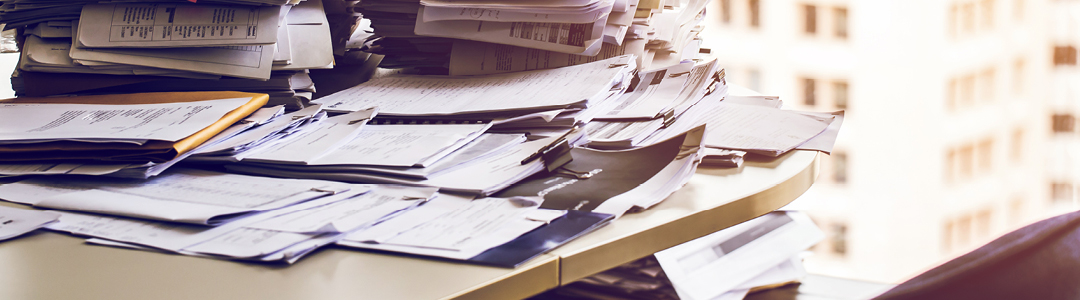 Piling paperwork and messy desks